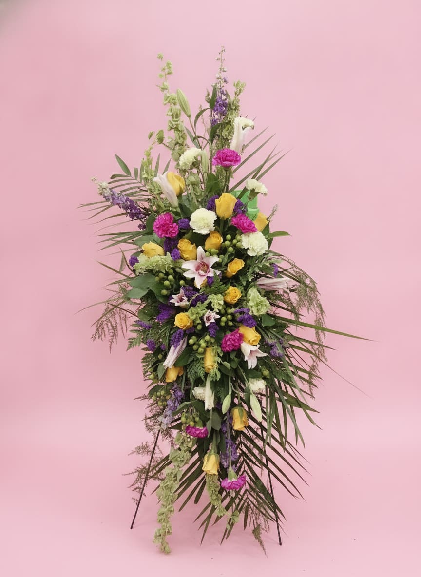 A Beautiful Journey - A lush garden-style tribute featuring roses, lilies, seasonal blooms