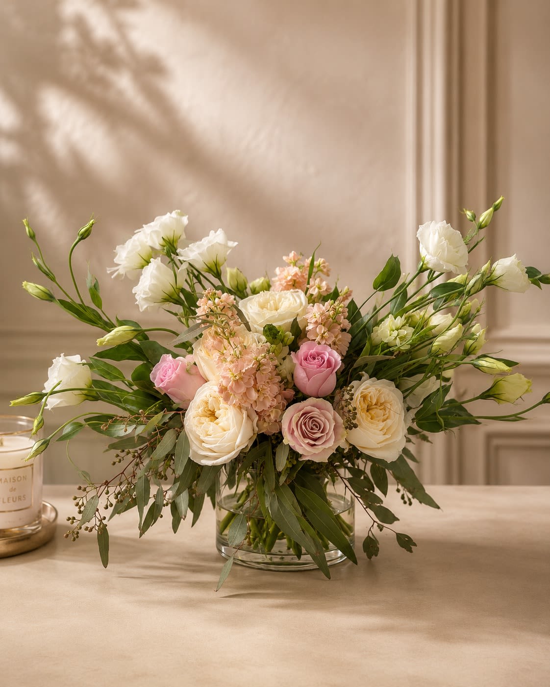 Rosé Reverie - A dreamy expression of elegance and romance, Rosé Reverie features a luxurious gathering of premium blush roses, delicate garden blooms, and lush seasonal accents artfully arranged in a sophisticated glass vase. Inspired by the beauty of a blooming English garden, this enchanting design showcases soft shades of pink, ivory, and peach that create a graceful and timeless statement.  Designed for life’s most meaningful moments, Rosé Reverie evokes charm, refinement, and effortless luxury. Whether celebrating love, expressing gratitude, or simply brightening someone’s day, this exquisite arrangement delivers beauty, sophistication, and unforgettable style.  An elegant floral masterpiece created for those who appreciate luxury in every detail. 