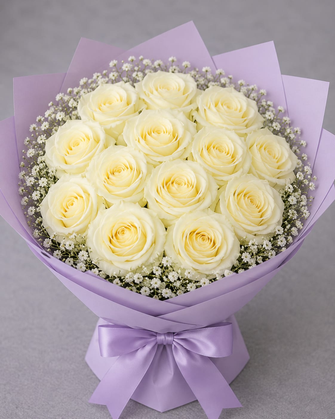 White Mondial Rose Bouquet - White Mondial Rose Bouquet  Elegant, graceful, and effortlessly sophisticated, this bouquet features premium White Mondial roses, renowned for their large, creamy-white blooms and luxurious petal formation. Their soft ivory tones create a refined and timeless appearance that complements any occasion.  White Mondial roses symbolize purity, sincerity, new beginnings, and everlasting love. Their classic beauty makes them a meaningful choice for celebrations, expressions of gratitude, heartfelt condolences, weddings, anniversaries, or simply brightening someone’s day with a thoughtful gesture.  Prized for their exceptional bloom size, long vase life, and elegant presence, White Mondial roses bring a sense of peace, beauty, and sophistication wherever they are displayed. Their delicate charm and luxurious appearance make them a favorite among florists and flower lovers alike.   Symbolism: Purity, Grace, Sincerity, New Beginnings, Respect, and Everlasting Love.  Rose Variety: Premium White Mondial Roses.  Perfect For: Weddings, Anniversaries, Sympathy Arrangements, Congratulations, Thank You Gifts, and Special Celebrations.