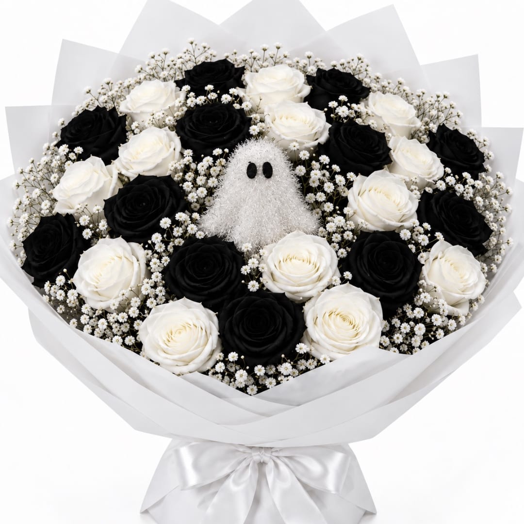 Black and white rose bouquet with a small ghost decoration in the center