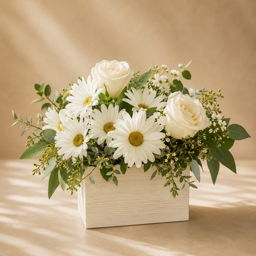 White roses and daisies in a light wood box arrangement