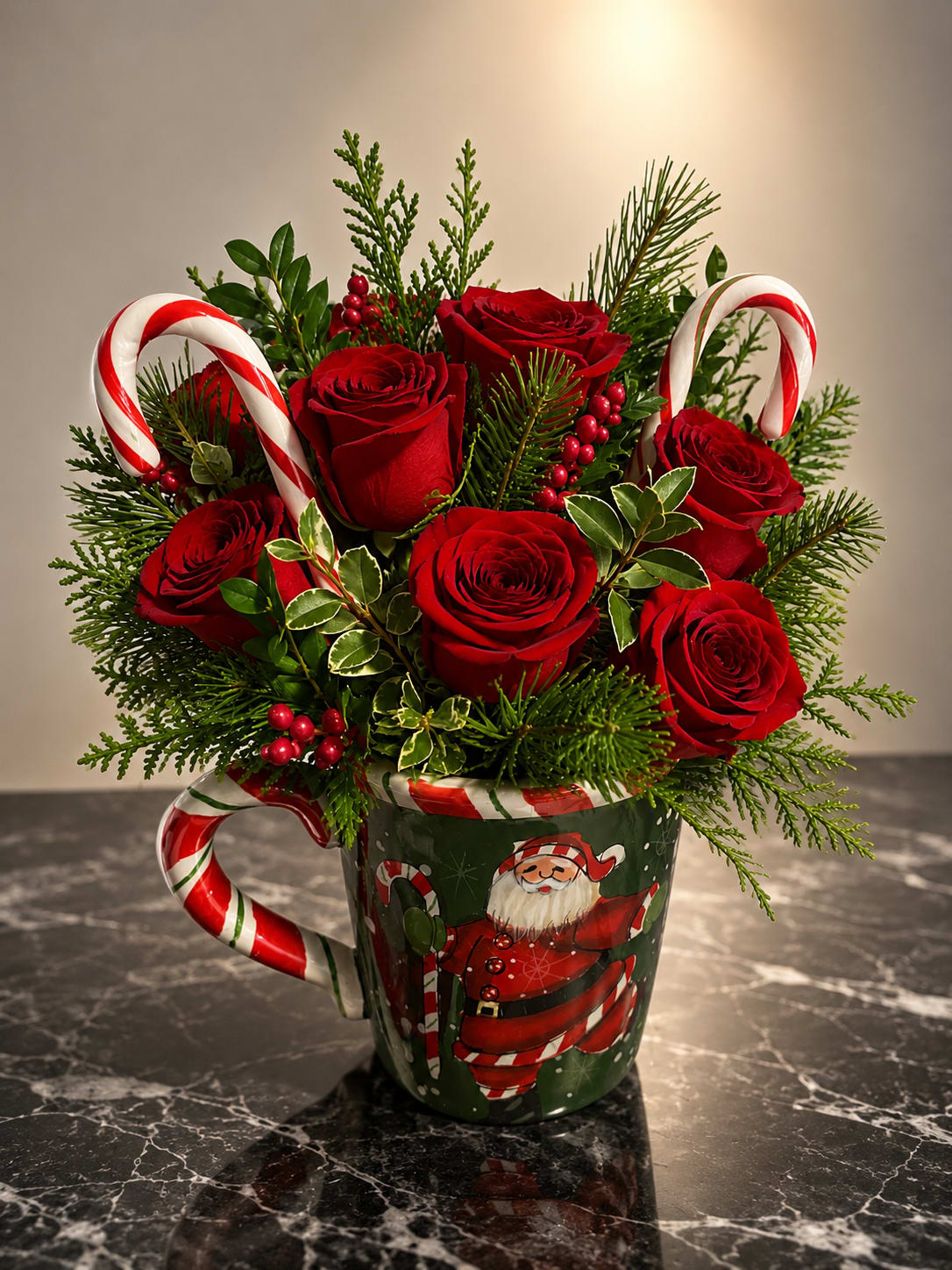 Christmas Cheer - Deep red roses gathered in a festive ceramic mug make a bright, joyful holiday bouquet perfect for a Christmas gift or winter centerpiece. The red, green and white color scheme reads instantly seasonal - the kind of arrangement that makes the person you're thinking of feel noticed and celebrated on Christmas morning or at a holiday gathering.  Tightly clustered roses sit amid mixed evergreen foliage and red berry accents for texture and a classic yuletide look. Candy canes arc playfully around the blooms and the arrangement comes in a sturdy ceramic mug, making it ready to display on a mantel, dining table, or office desk. The compact composition is designed to feel cheerful and homey rather than formal.  Ideal for neighbors, teachers, coworkers, or anyone who loves traditional holiday charm, this bouquet sends a warm, festive message without fuss. The mug makes it an easy keepsake-recommend refreshing the water every couple of days and trimming stems slightly if you transfer to a vase for longer enjoyment.