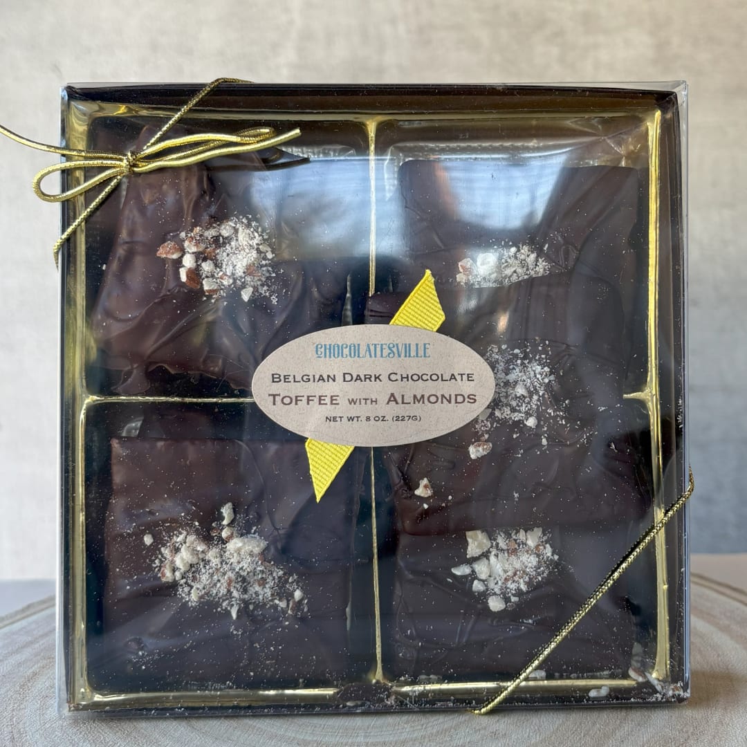 Box of dark chocolate toffee pieces with almonds