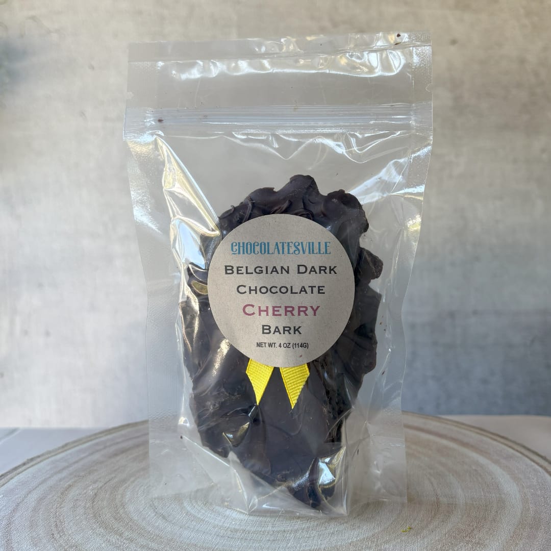 Bag of Belgian dark chocolate cherry bark with a yellow ribbon