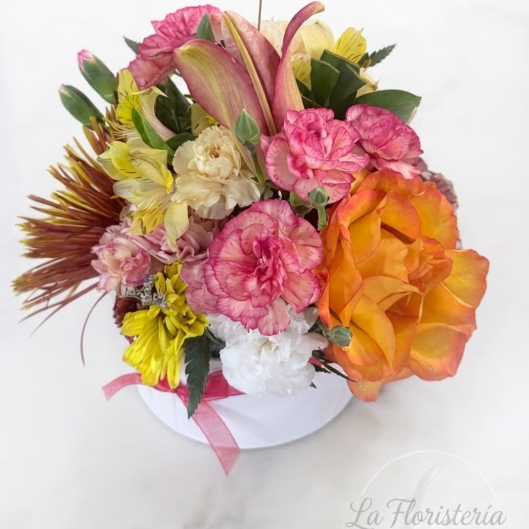 Mixed bouquet in a white hat box with pink and orange flowers