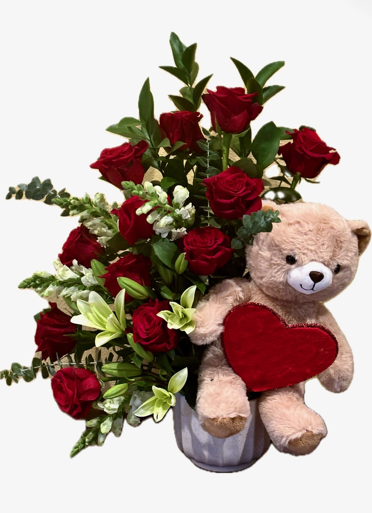 Love is in the Air - Nothing says “LOVE” more than a teddy bear and red roses. Gift this 12 red rose and lily arrangement with a teddy bear to show your love.