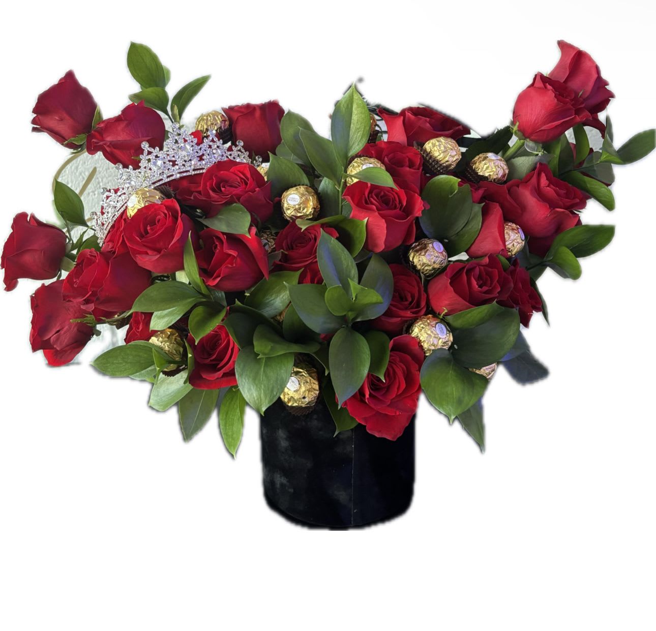Dulce Amor - A large box arrangement to make them feel special and loved. Red roses to feel the love, a crown to feel like a queen, and 12 chocolates for a treat!  Includes: 12 chocolates, red roses, a small crow , and greenery in a box.