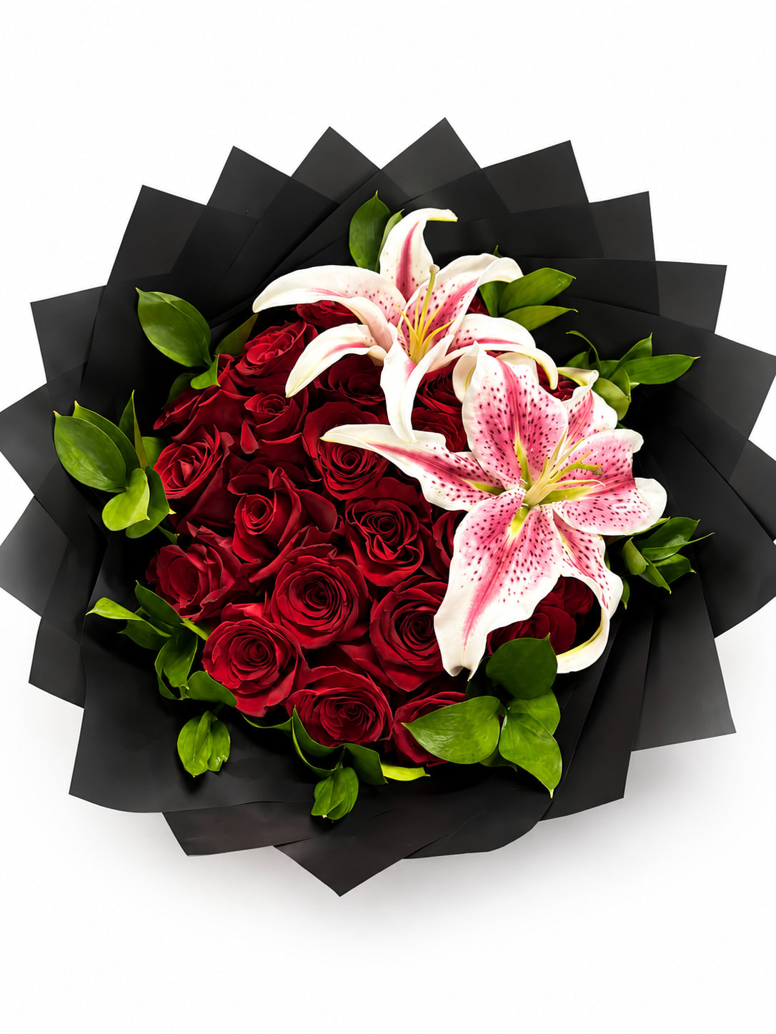 Bouquet of red roses and pink lilies wrapped in black paper