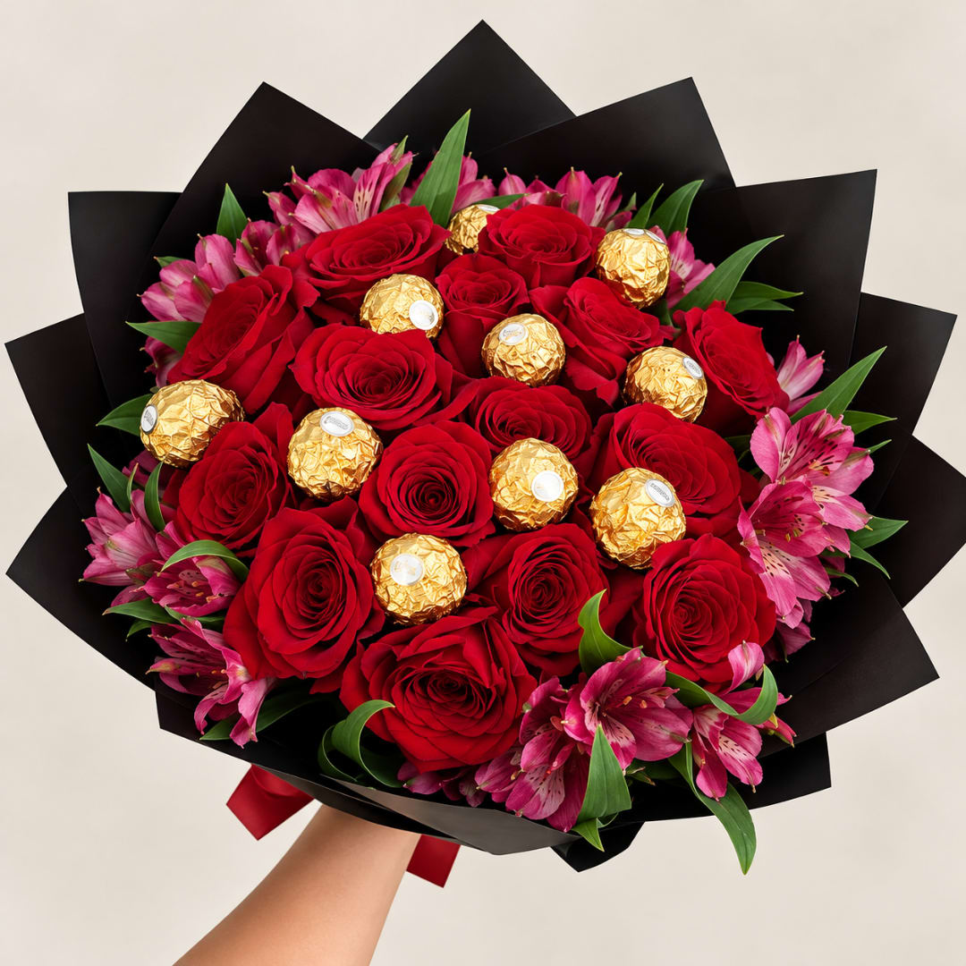 Bouquet of red roses, pink alstroemeria, and gold-wrapped chocolates