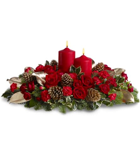 Lovely and Luminous - Gleaming, lovely and luminous, this beauteous display of red roses and carnations - accented with golden elements - is a divine way to adorn your holiday table, and equally exquisite on a sideboard. At almost two feet wide, it's a dramatic way to decorate your seasonal celebration.    Red roses and carnations, accented with fresh evergreens and gold-sprayed pinecones and magnolia leaves, are arranged in a dish around two red pillar candles.    Approximately 23" (W) x 11" (H)    Orientation: All-Around        As Shown : TFWEB472    