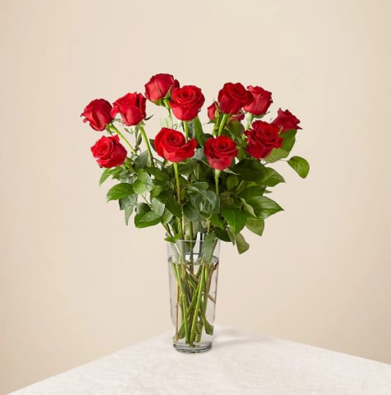 Long Stem Red Rose Bouquet – 12 Red Roses - You can never go wrong with a bouquet of hand delivered long stem red roses from a local florist. Let our network of expert florists design this timeless red bouquet to make a statement for your special someone. Red flowers are an elegant, iconic and romantic gift for anyone close to your heart. Each rose is handcrafted and hand delivered to say I love you directly from a local florist to their home or office.