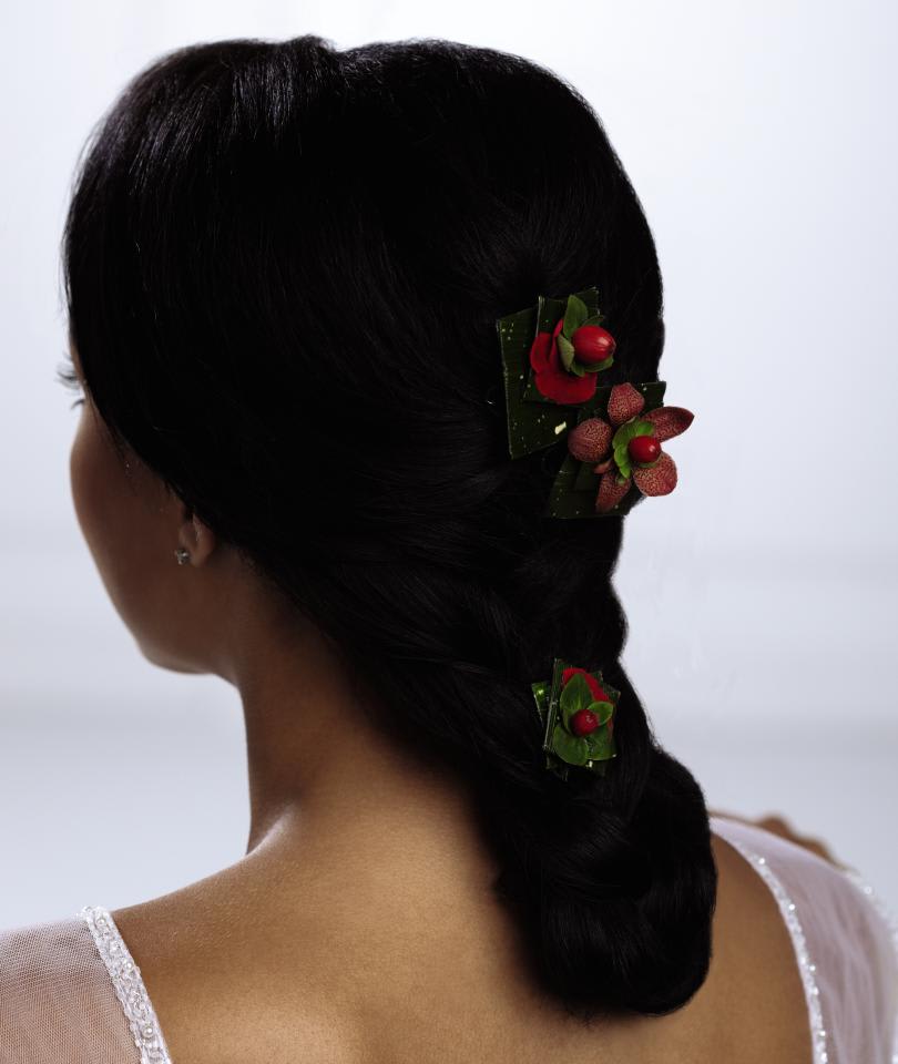 FTD Very Berry Hair Decor - The FTD Very Berry Hair DÃ©cor is a wonderful way to give you or your   bridesmaids a sweet and charming look. Red rose petals, red hypericum   berries and a single vanda orchid bloom are perfectly arranged on hair   combs to be placed at different places within the finished hairstyle.   Approx. 8âH x 2'W. 