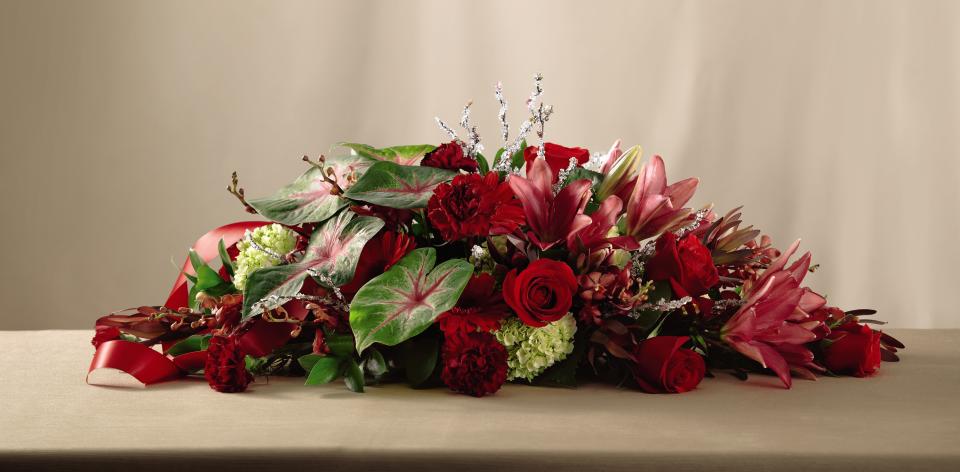 FTD One &amp; Only Altar Arrangement - The FTDÂ® One and Onlyâ¢ Altar Arrangement is a gorgeous expression of   love and romance. Red mokara orchids, burgundy carnations, green mini   hydrangea, red gerbera daisies, red roses, dark pink Asiatic Lilies,   leucadendron and a variety of lush greens are accented with iced branch   pics and a red satin ribbon to create an impressive look to add to the   space you will declare your love for one another. Approx. 14âH x 36âW. 