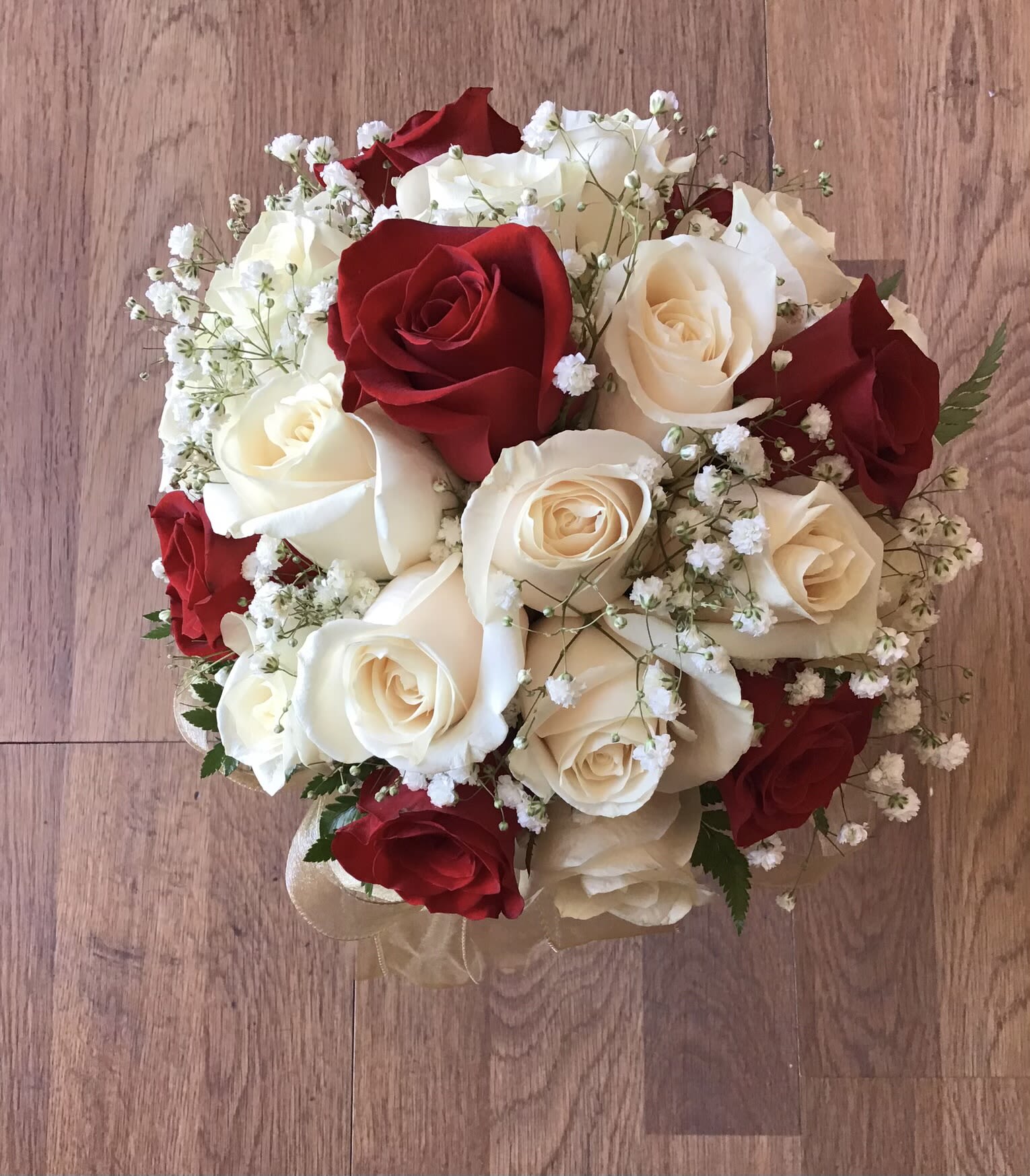 Classic Bridal Bouquet - Classic round bridal Bouquet with baby's breath and greenery.