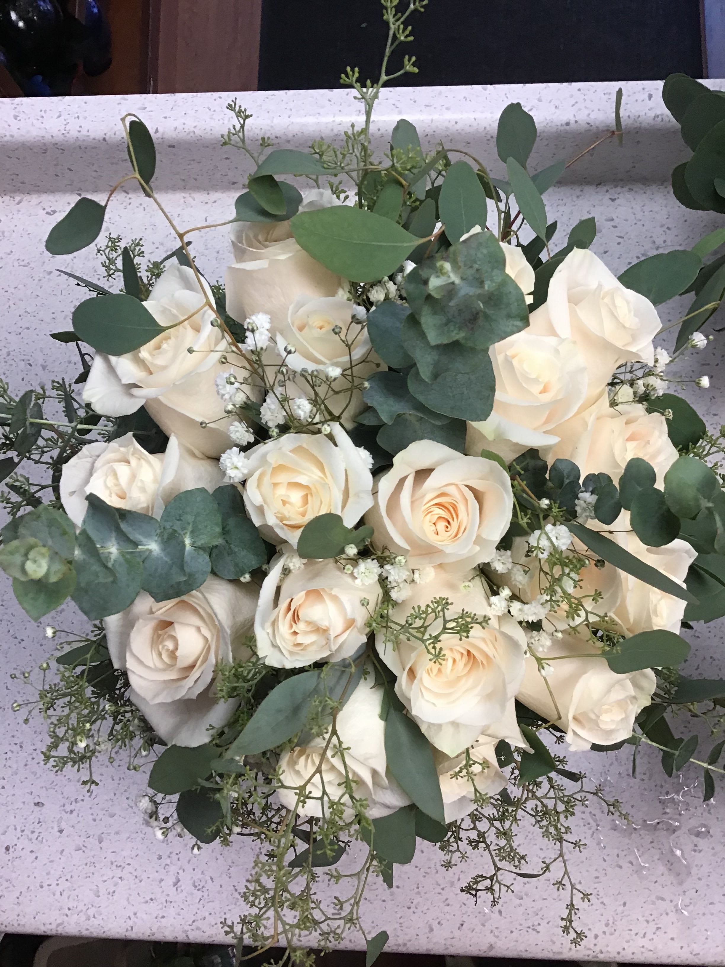 Hand Bridal Bouquet - Elegant Bridal Bouquet with fresh Roses and a variety of Eucalyptus.
