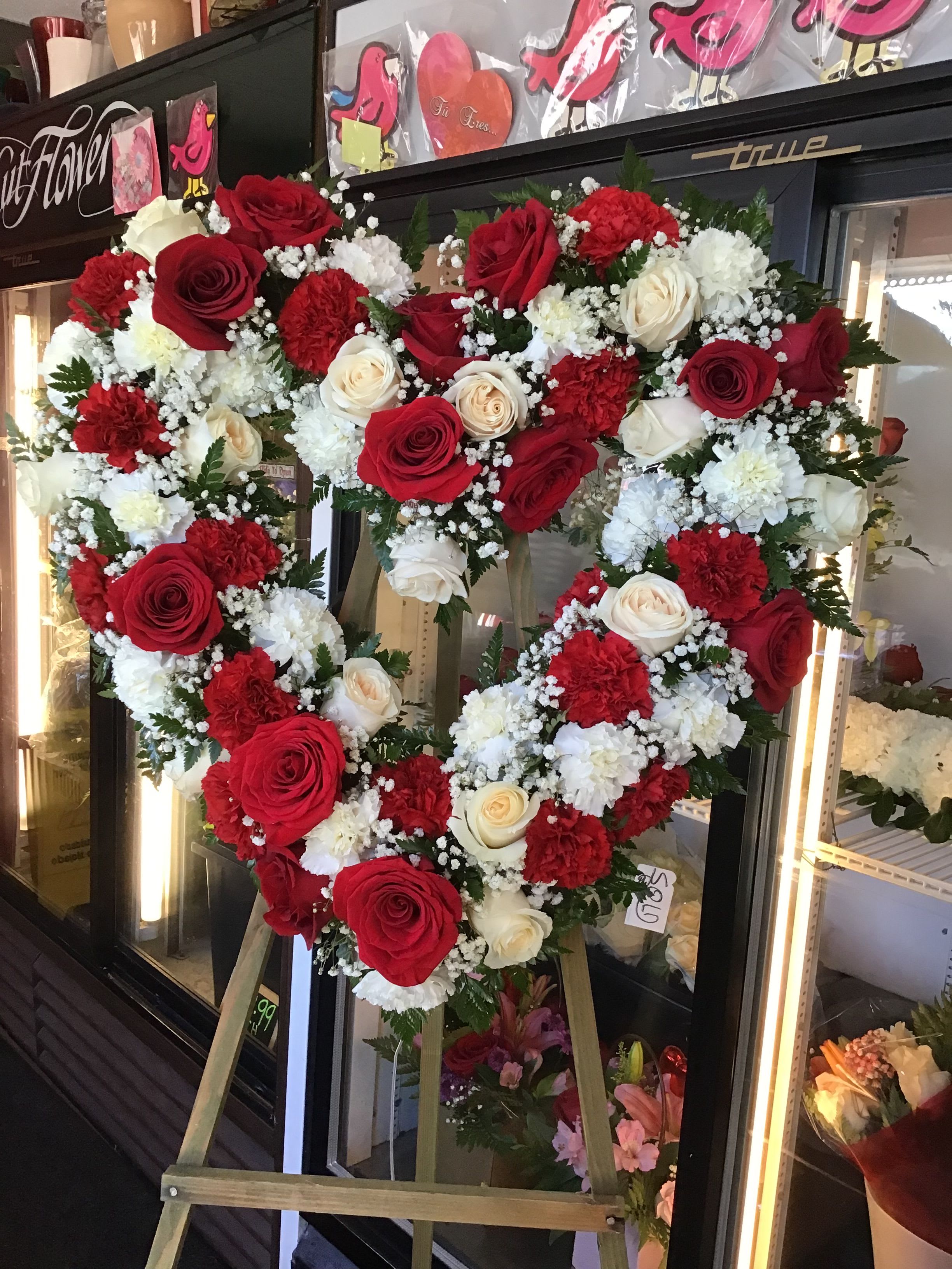 Sympathy Heart with Roses and Carnations - Beautiful sympathy heart spray made with roses and carnations.
