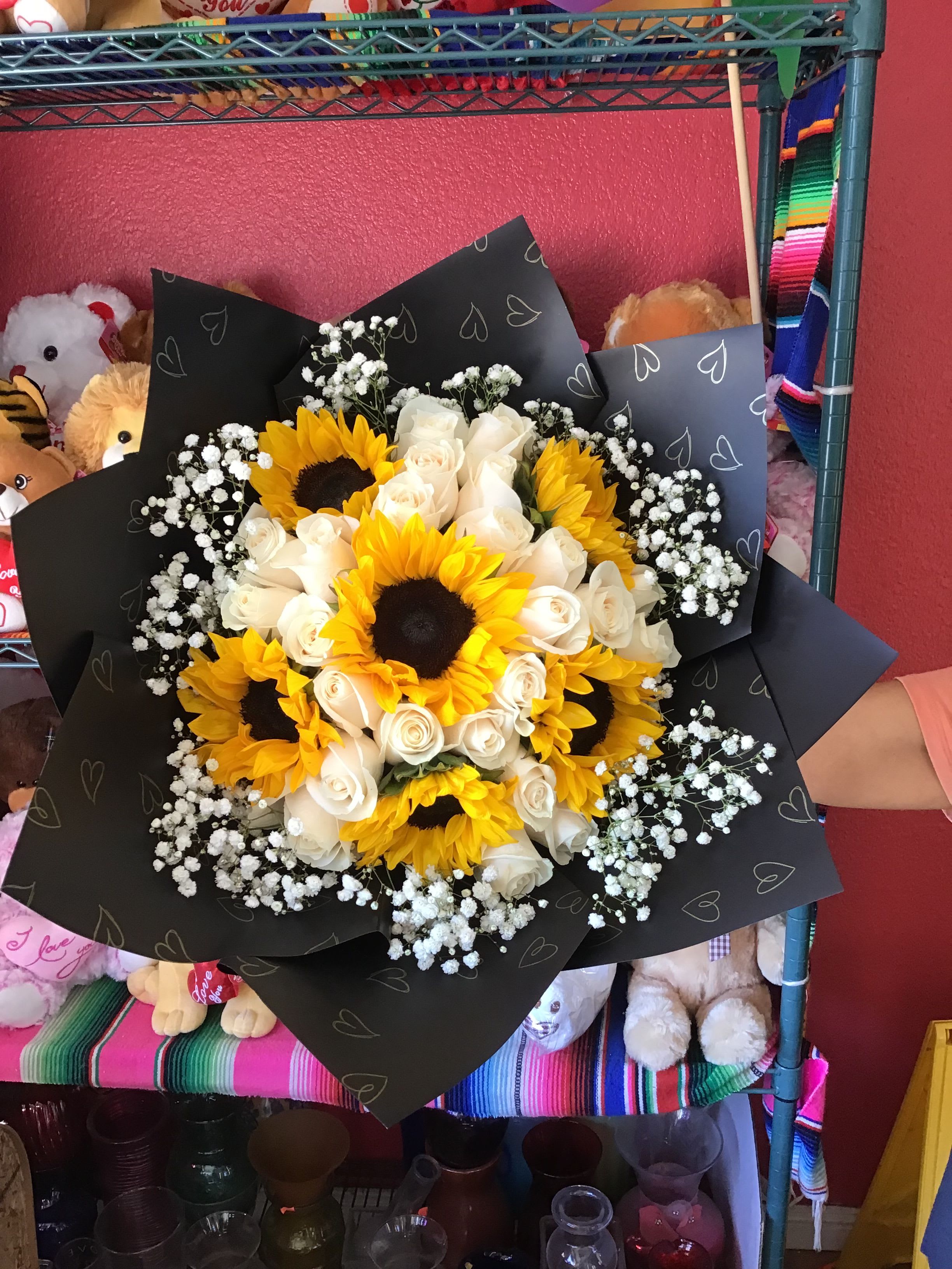 Ramo Buchon with Sunflowers - Beautiful 50 rose ramo buchon with sunflowers, wrapped in paper and a bow.  **Wrapping paper is subject to availability. While the design or pattern may vary, we will do our best to use a similar color and maintain the overall look of the bouquet.**