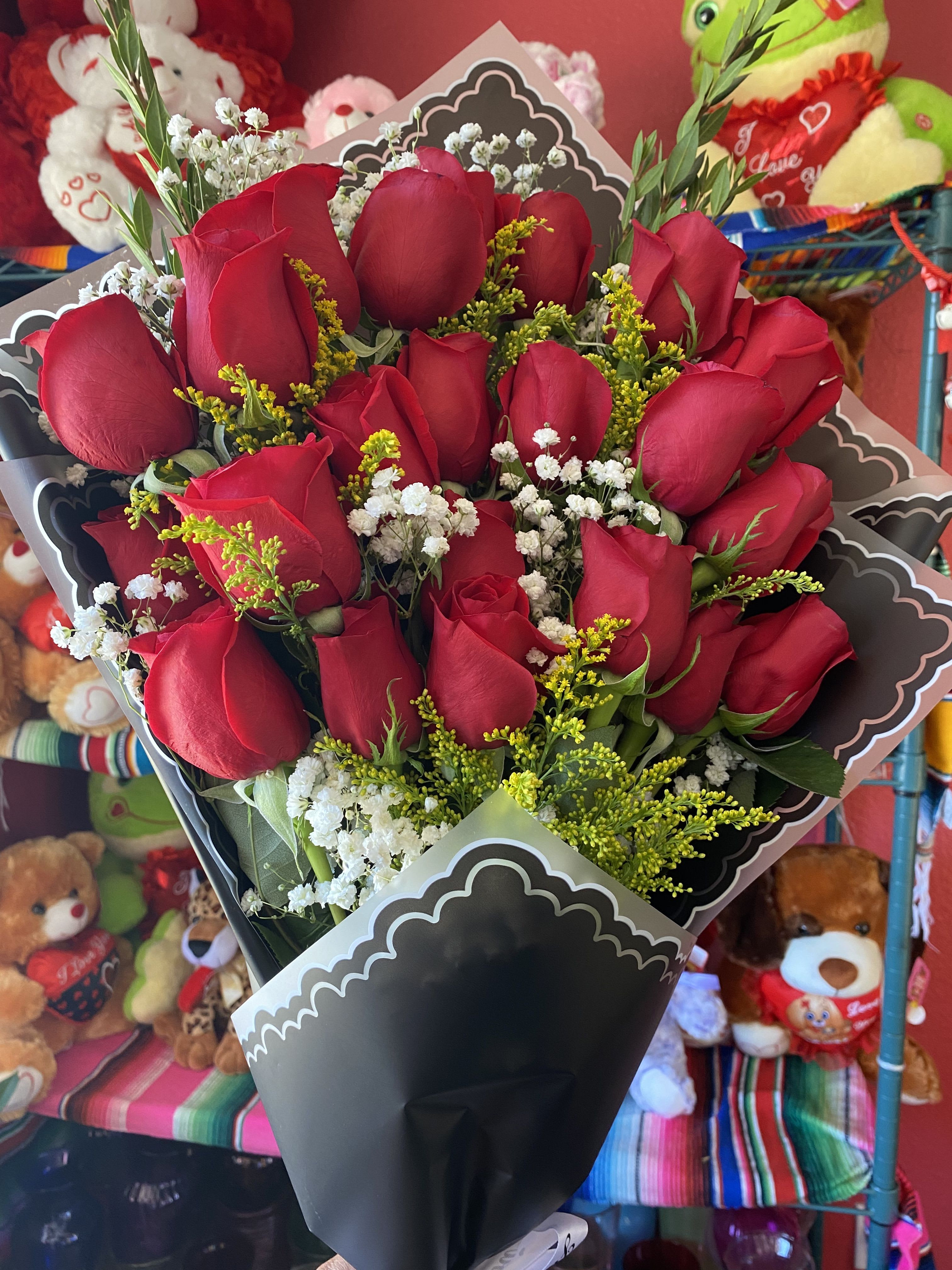 Front-facing Bouquet - Beautiful front facing red rose bouquet wrapped in paper and accompanied with greenery. Perfect option for celebrating graduation day or just to show your love to your special someone.  **Wrapping paper is subject to availability. While the design or pattern may vary, we will do our best to use a similar color and maintain the overall look of the bouquet.**  If you would like one of the available colors below, please specify your preference in the Special Instructions section when placing your order, if not then the order will be made with red roses. Color requests are subject to availability.  Available Colors:  1)Pink 2)Yellow 3)Off-White 4)Fuchsia
