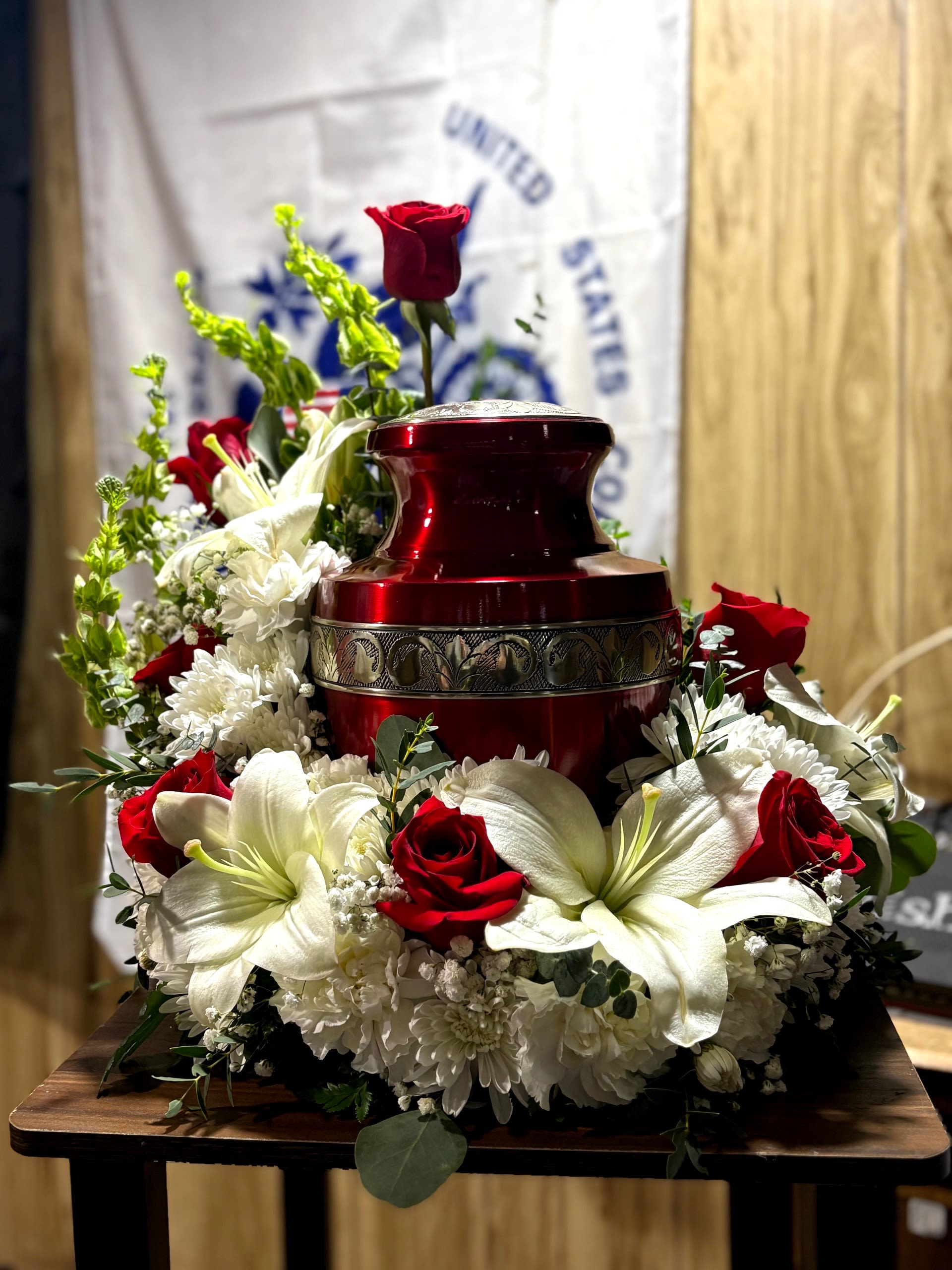 Forever in Our Hearts - This beautiful Urn Arrangement is a timeless tribute that honors a cherished life with grace and dignity. Designed to frame a loved one's urn with beauty and serenity. A comforting expression of sympathy, it offers family and friends a meaningful way to celebrate treasured memories and a life that will always be remembered.