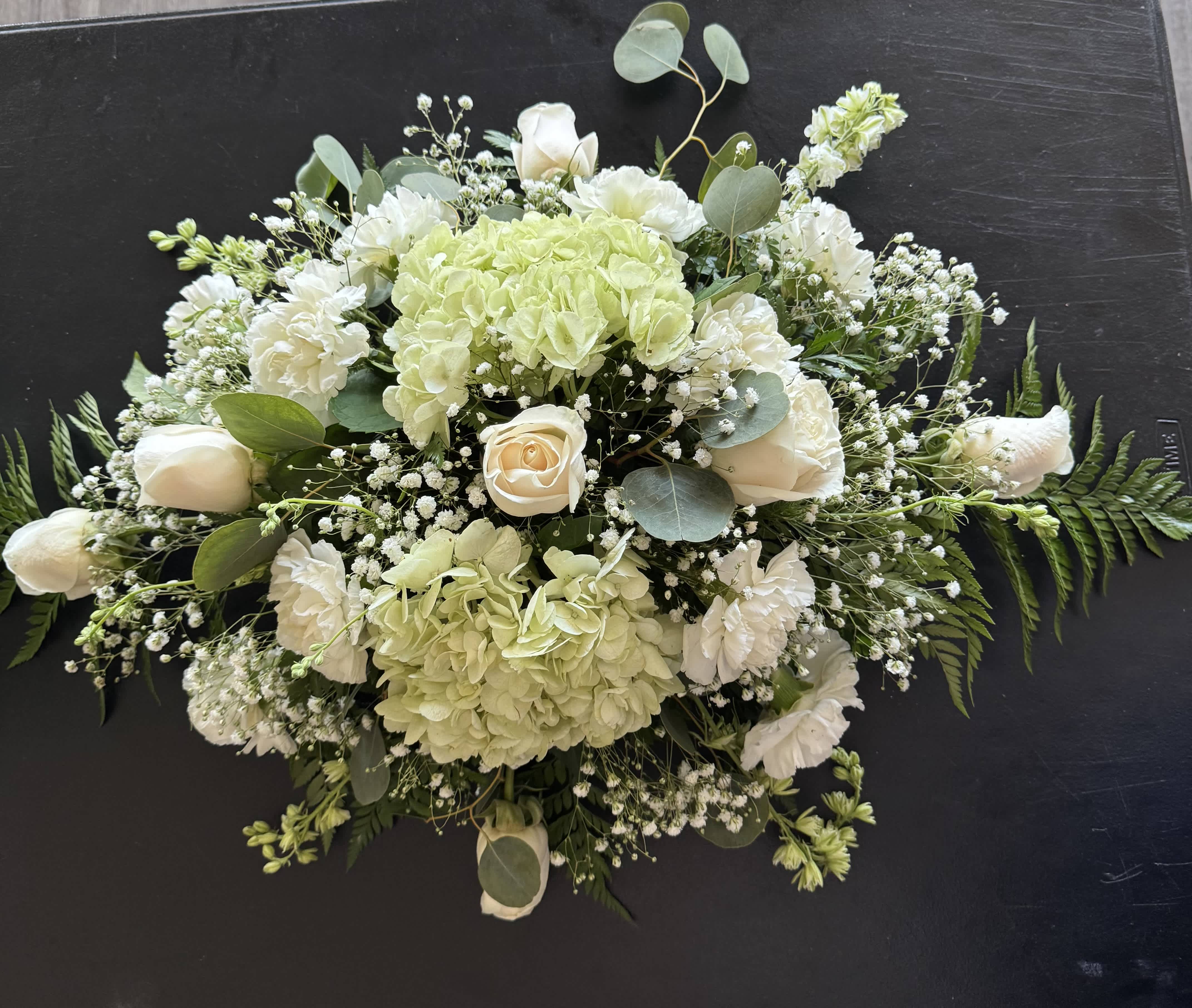 White and pale green floral spray with roses and hydrangeas