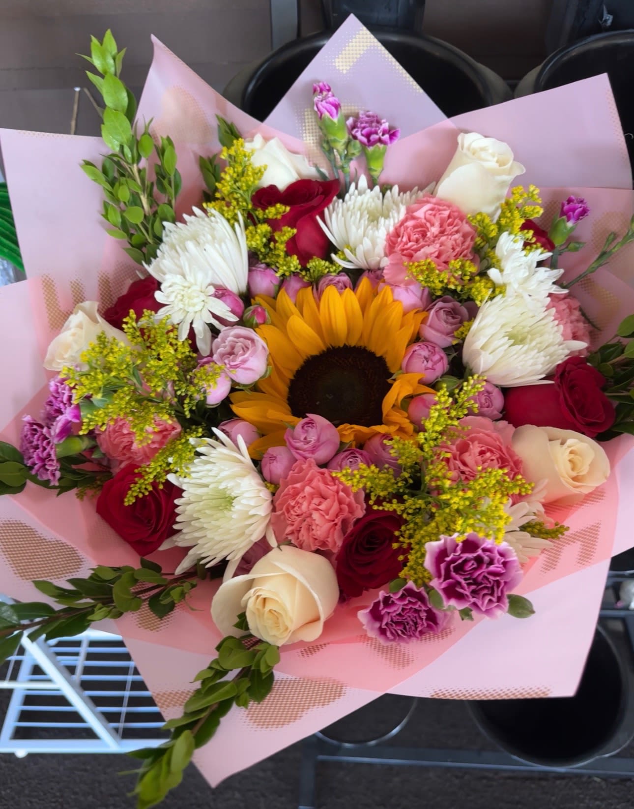 Springtime Happiness - Beautiful mixed flower bouquet made with springtime colors.  **Colors and flowers may change based on the season and availability, but the bouquet will keep its same design. **  **Wrapping paper is subject to availability. While the design or pattern may vary, we will do our best to use a similar color and maintain the overall look of the bouquet.**