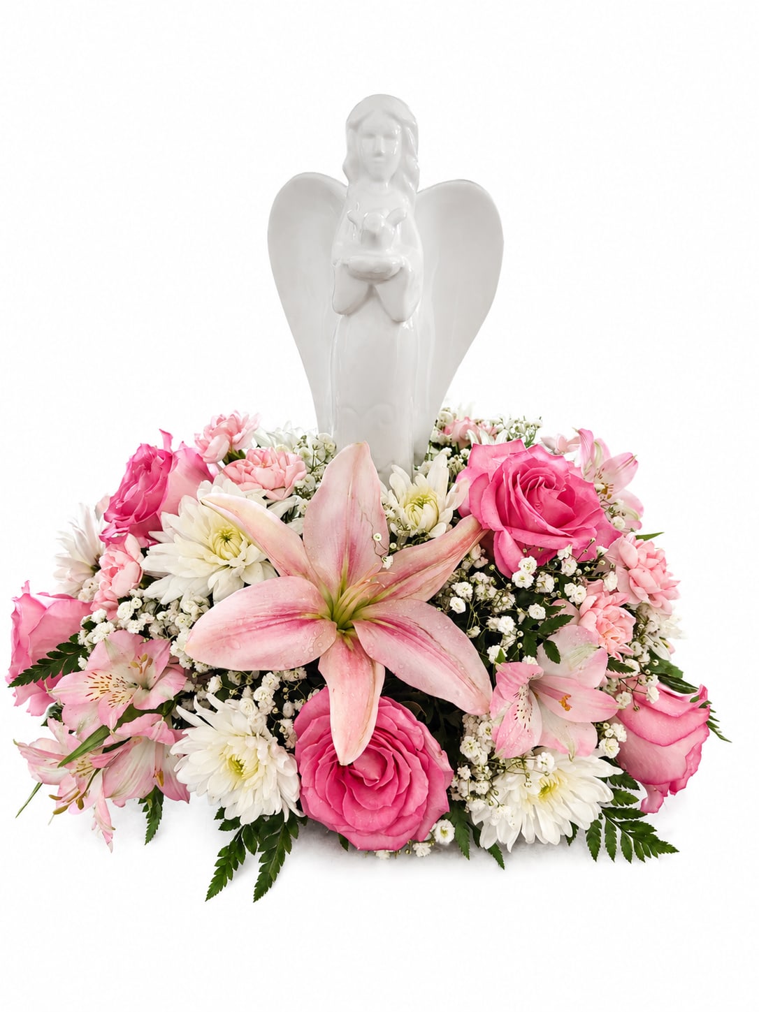 Pink and white floral arrangement with an angel figurine centerpiece