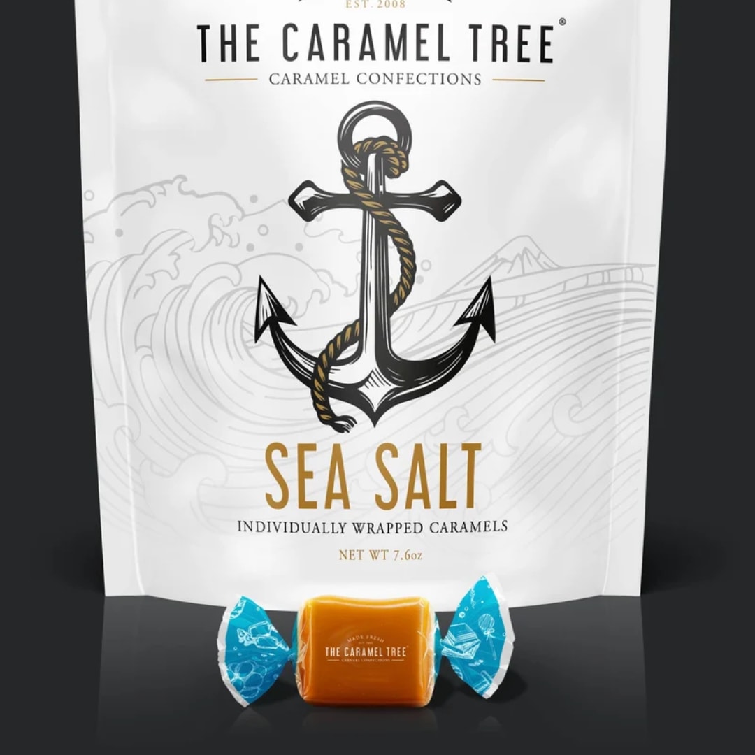 Bag of sea salt caramels with one wrapped caramel in front