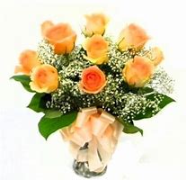 Bouquet of orange roses with baby's breath and a peach ribbon