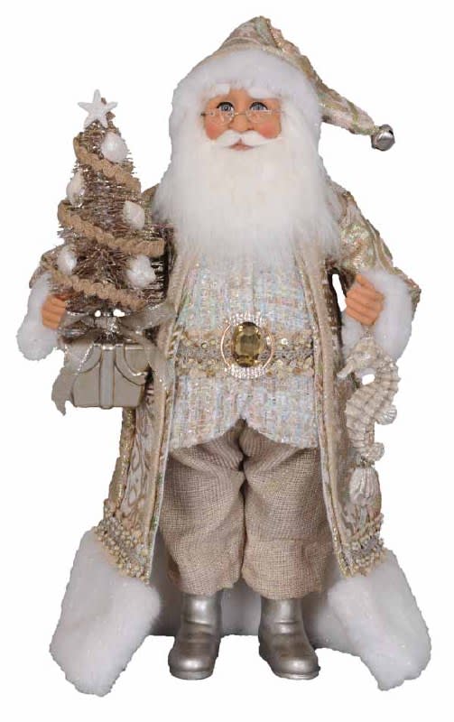 Decorative Santa figurine holding a small Christmas tree and gift bag