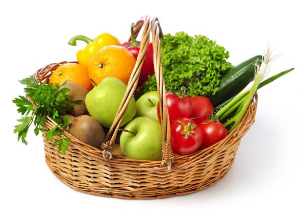 Wicker basket filled with assorted fruit and vegetables