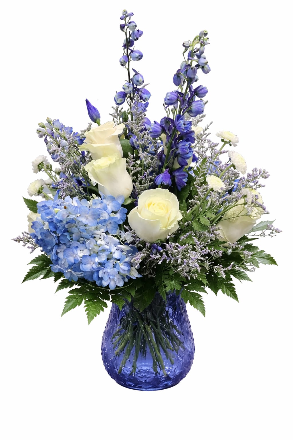 Blue and white floral arrangement in a cobalt glass vase