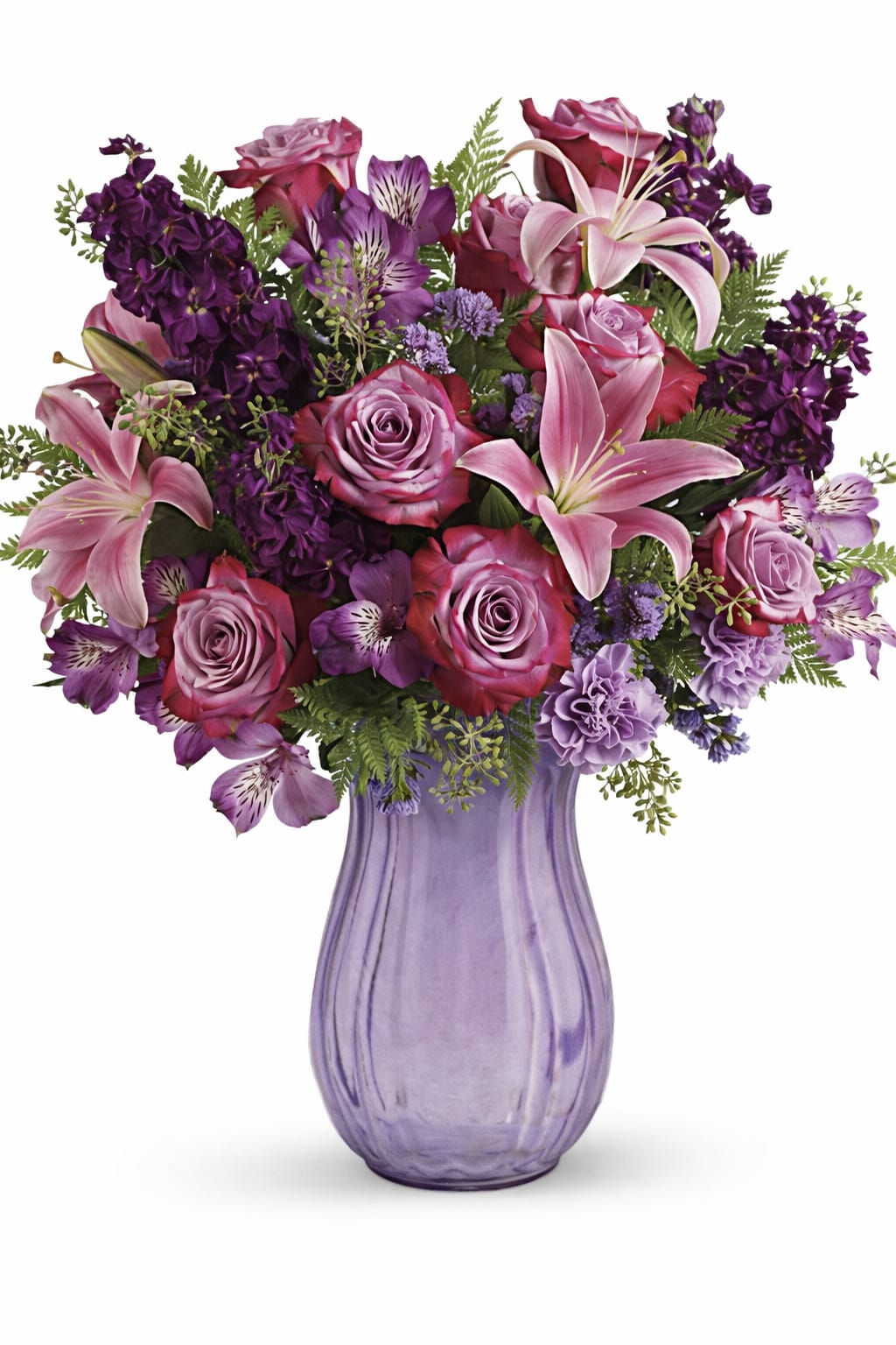 Amethyst Jewel Bouquet - This regal arrangement of lavender roses and pink lilies is naturally breathtaking. The Bouquet features lavender roses, purple stock, pink asiatic lilies, purple alstroemeria, lavender carnations, lavender sinuata statice, seeded eucalyptus, and leatherleaf fern.