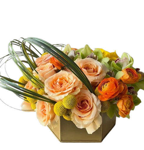 Citrus Bloom Luxe - Citrus Bloom Luxe is a sophisticated floral arrangement designed with rich color, texture, and modern elegance. Featuring premium apricot roses, vibrant orange ranunculus, graceful green cymbidium orchids, and cheerful yellow button blooms, this stunning design is arranged in a sleek contemporary container with dramatic sculptural foliage accents. Its radiant blend of citrus-inspired tones creates a fresh and luxurious statement, making it a perfect gift for birthdays, celebrations, congratulations, or adding upscale beauty to any space.