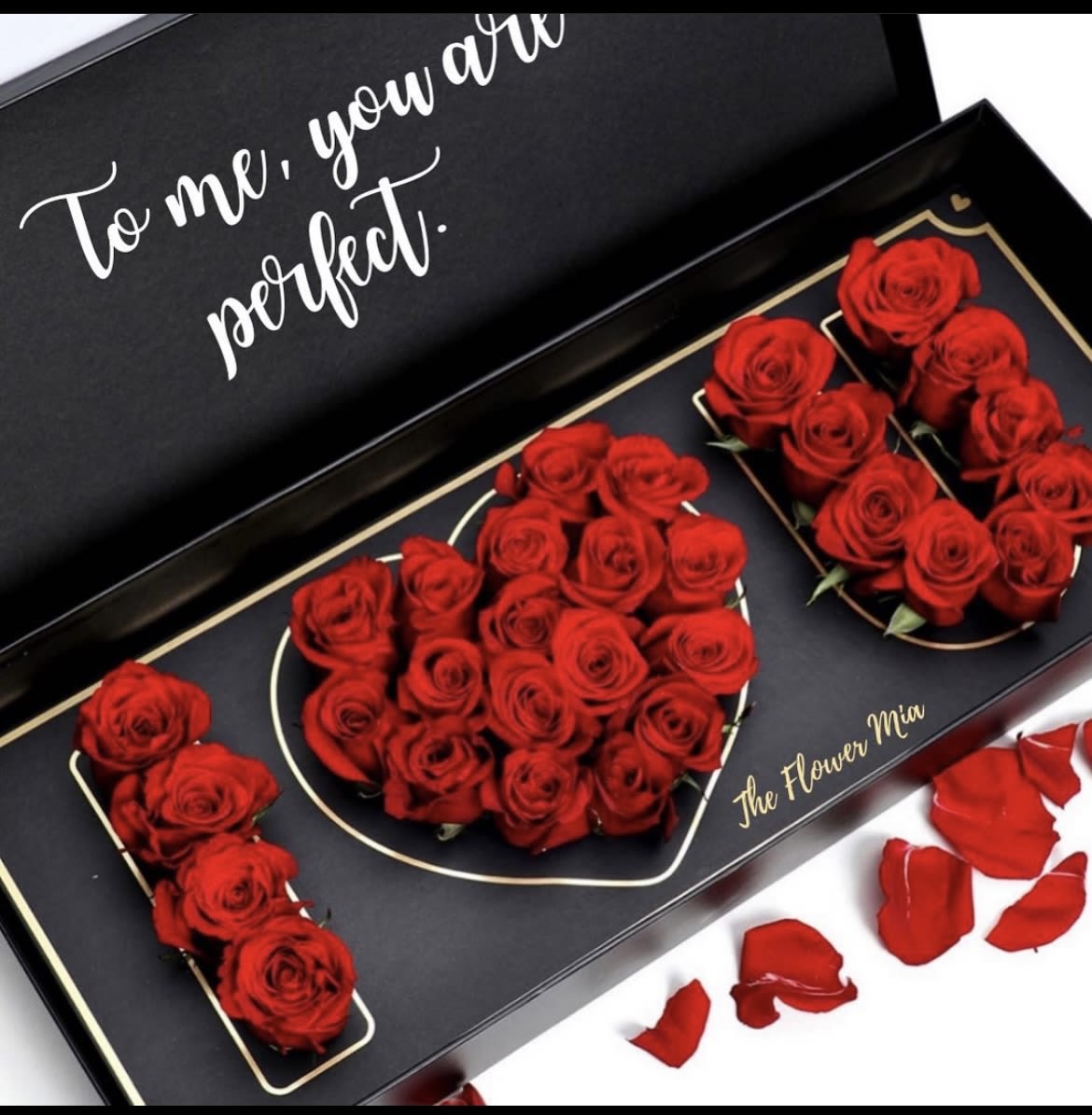 I LOVE YOU BOX - Red roses arranged in a black gift box with gold trim and romantic letter-like groupings-bold, graphic and perfect for anniversaries or declaring your love.