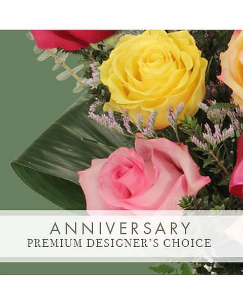 Bouquet of yellow and pink roses with greenery