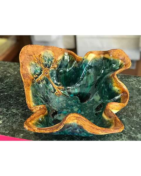 Decorative ceramic bowl with teal and gold glaze