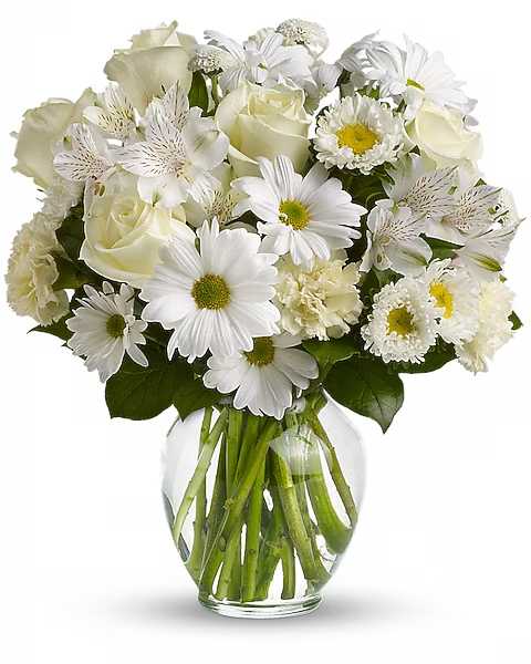 White mixed bouquet in a clear glass vase