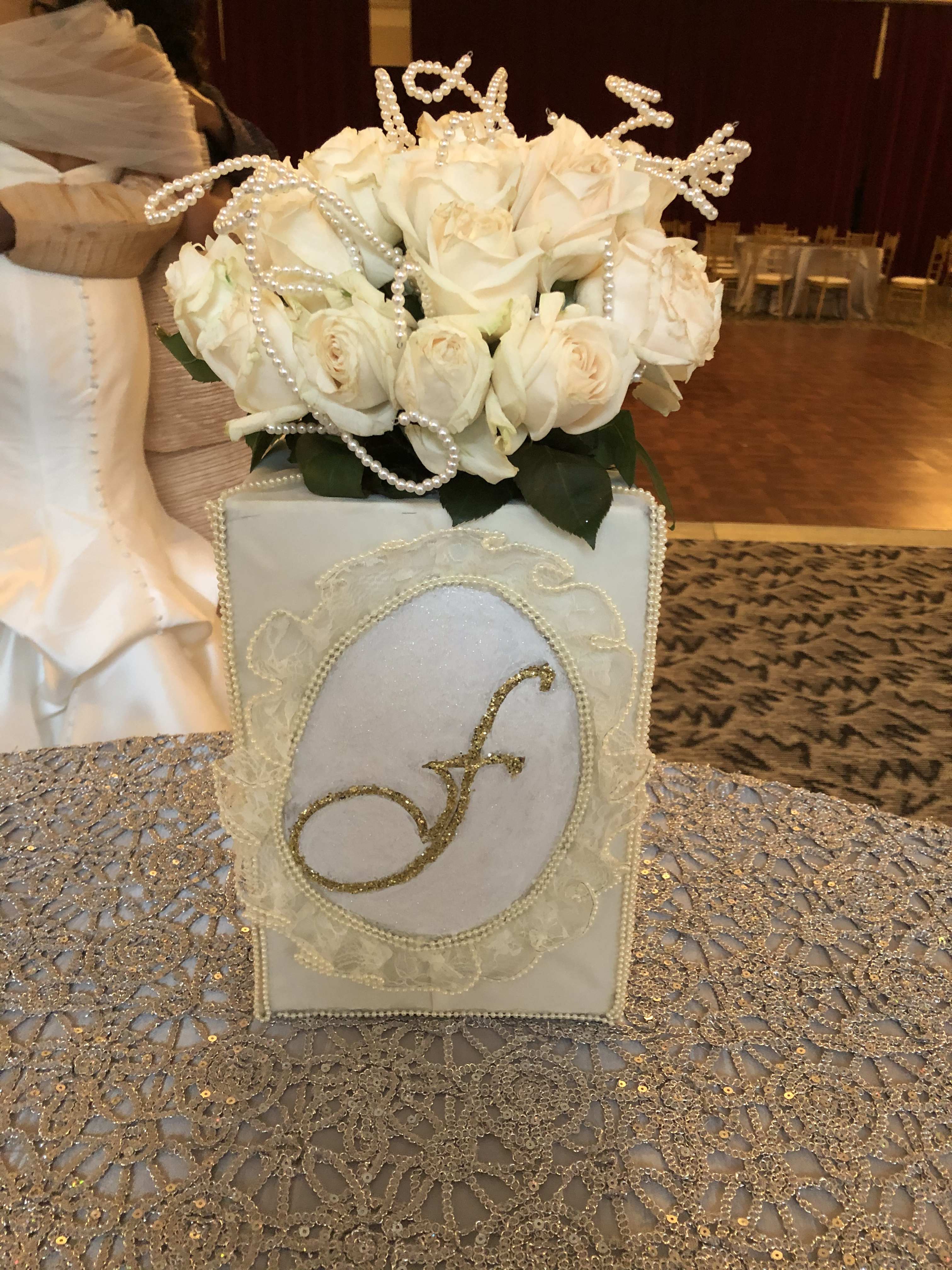 White rose arrangement in a decorated square box with pearl accents