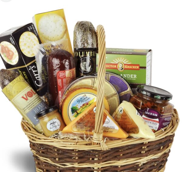 Gift basket with assorted cheeses, crackers, and jars of preserves