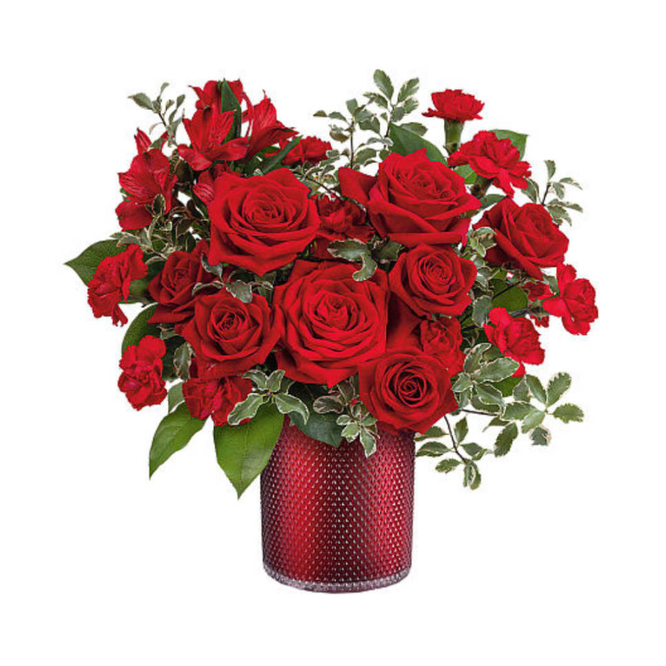 Red roses and carnations in a red textured vase