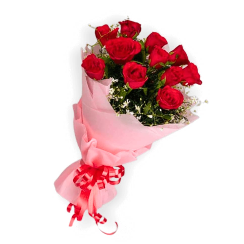 Bouquet of red roses wrapped in pink paper with a red ribbon