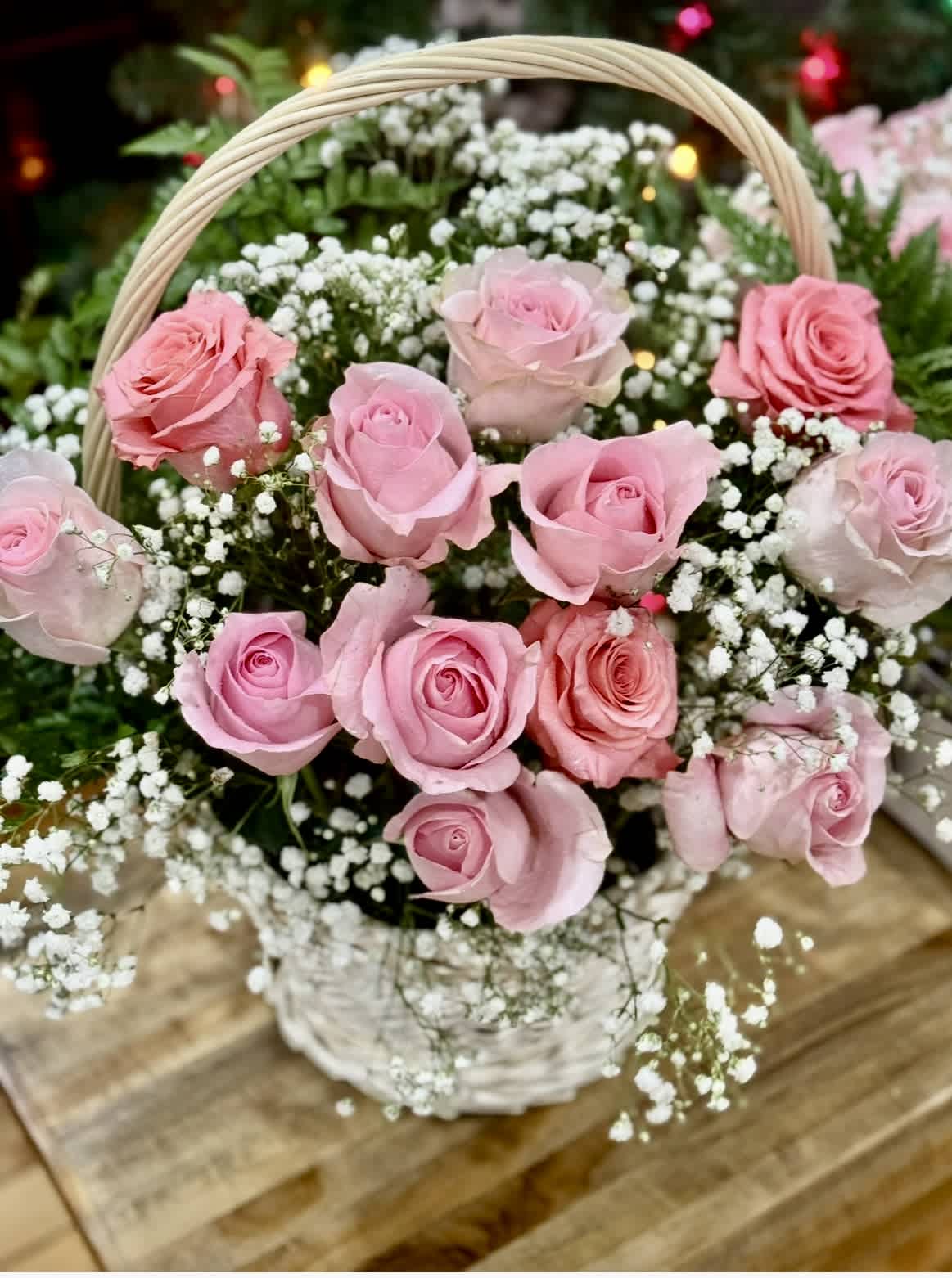 Basket of pink roses with white baby's breath