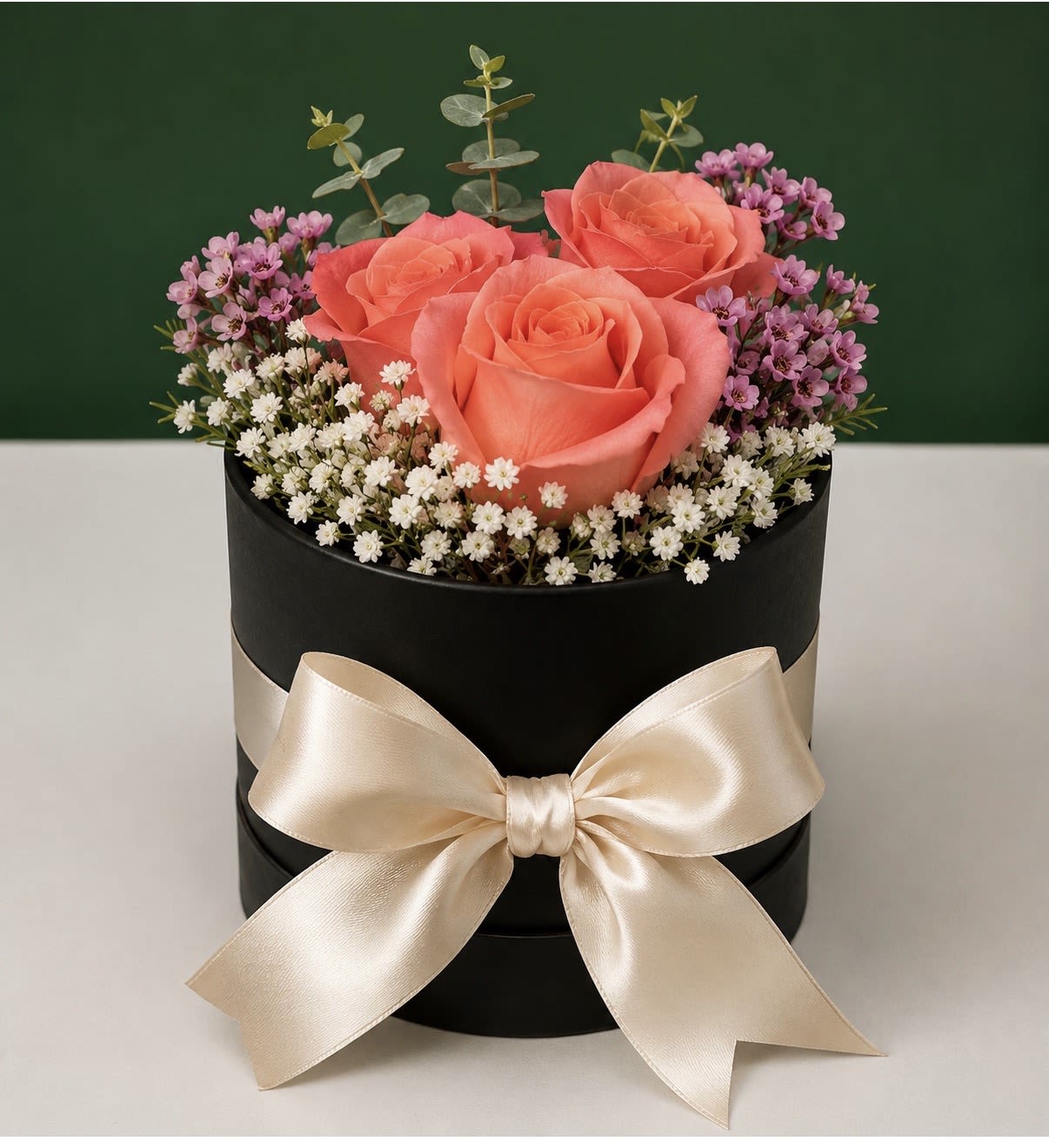 Petite Bloom Box  - Fresh seasonal blooms arranged in our signature box, perfect for birthdays, anniversaries, thank-you gifts, or just because. Available in White, Pink, Light Orange, Citrus, or Black. Flower colors may vary by season.