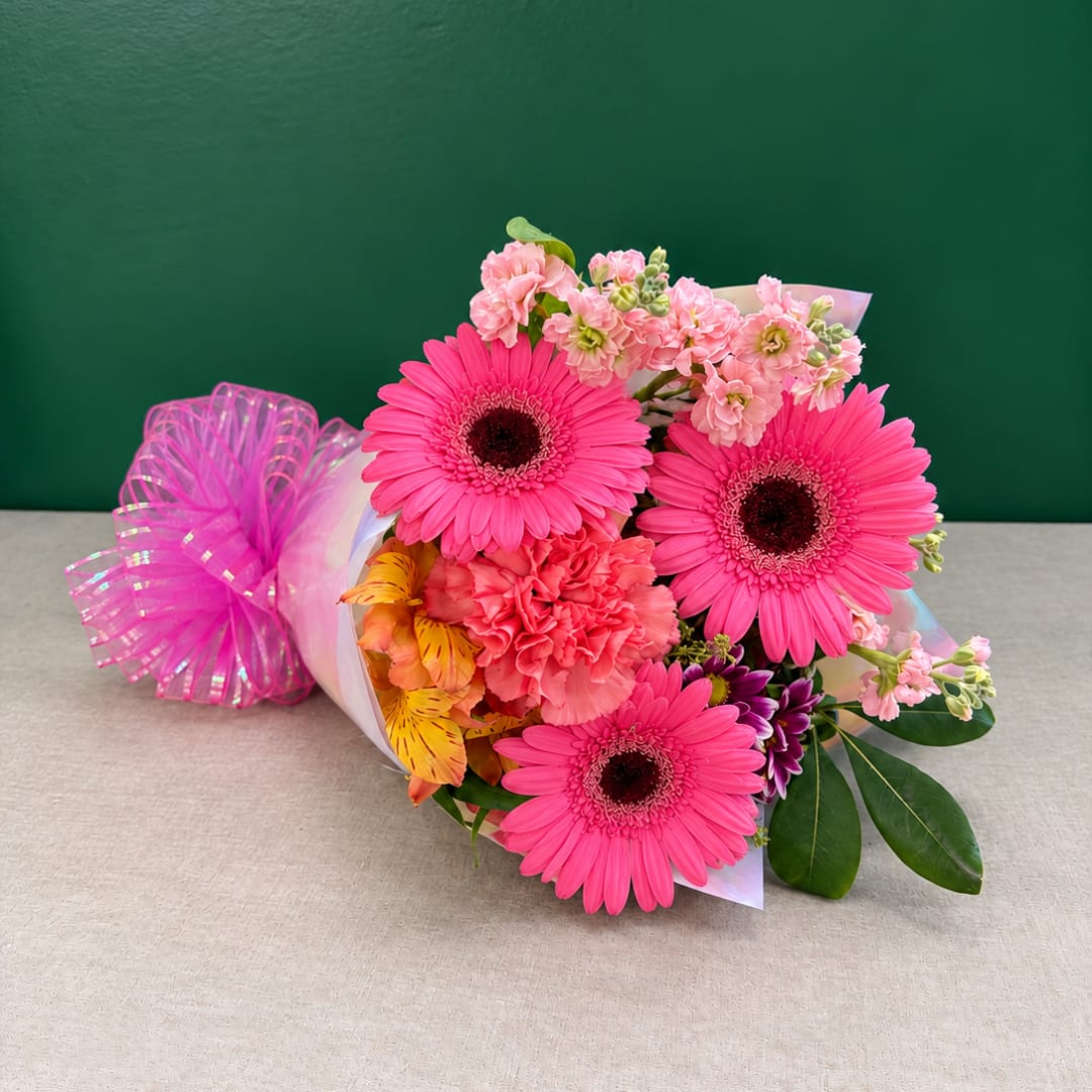Pink gerbera bouquet with carnations and ribbon wrap