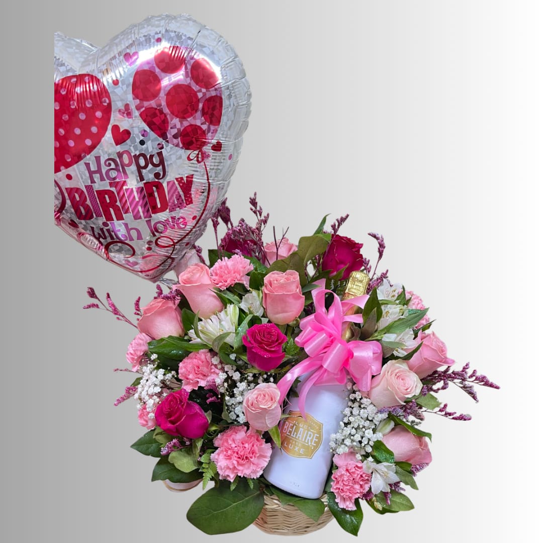 Pink rose bouquet with a birthday heart balloon and a bottle in a basket