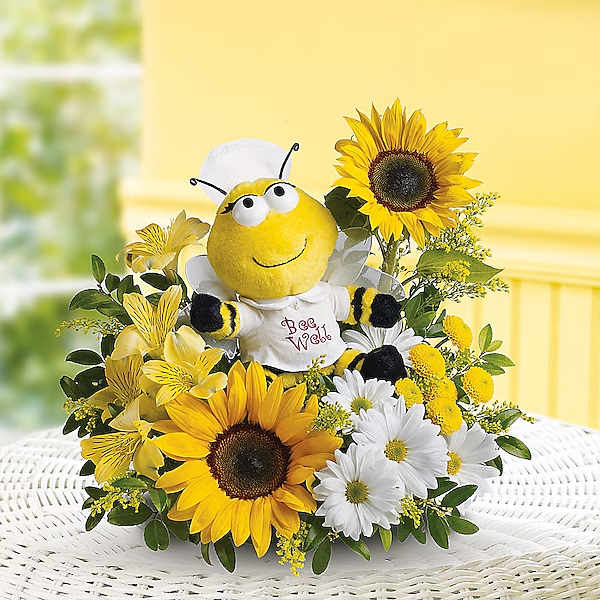 Sunflower and daisy arrangement with a bee plush centerpiece