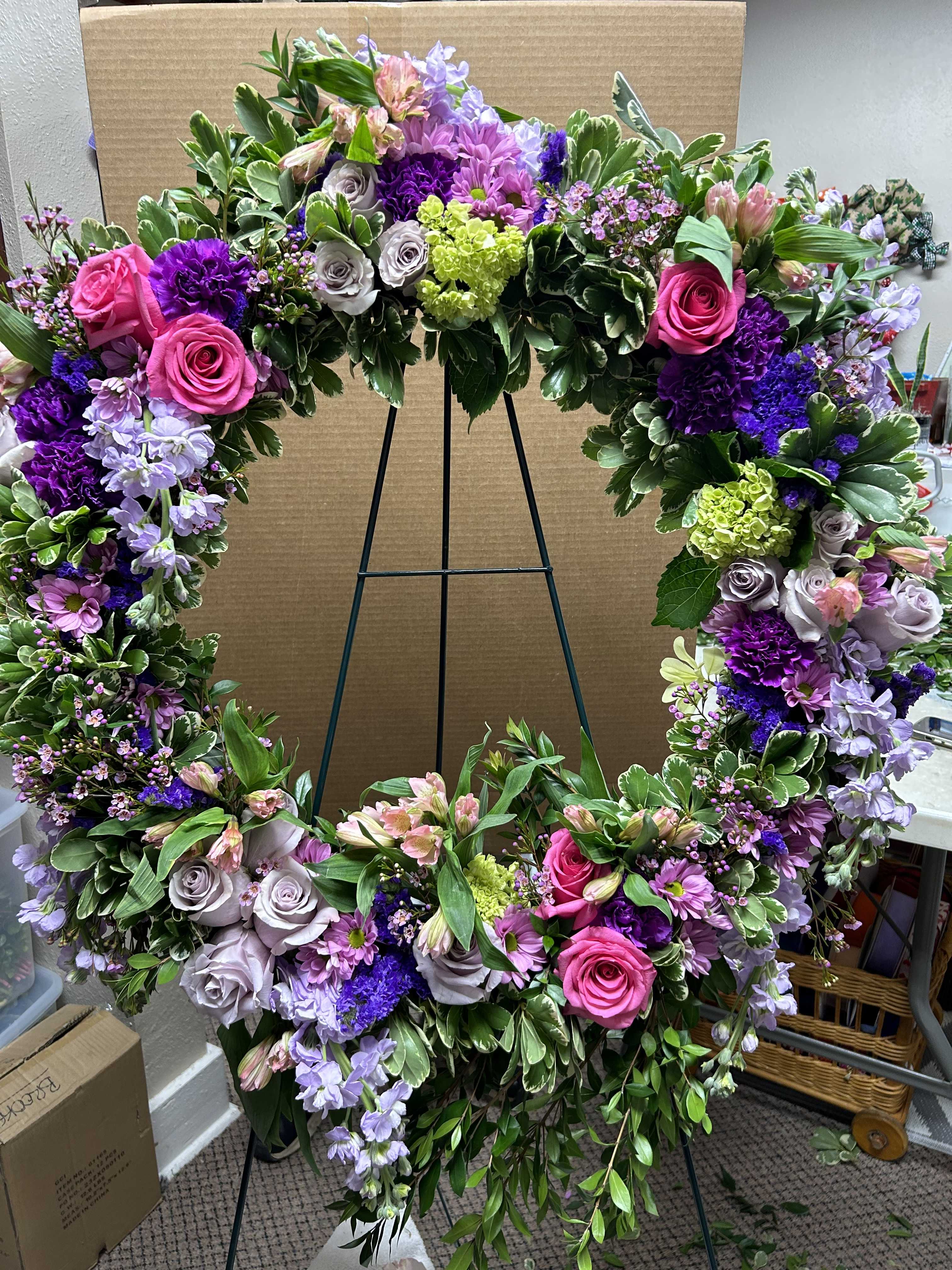 Large floral wreath with pink, purple, and lavender flowers