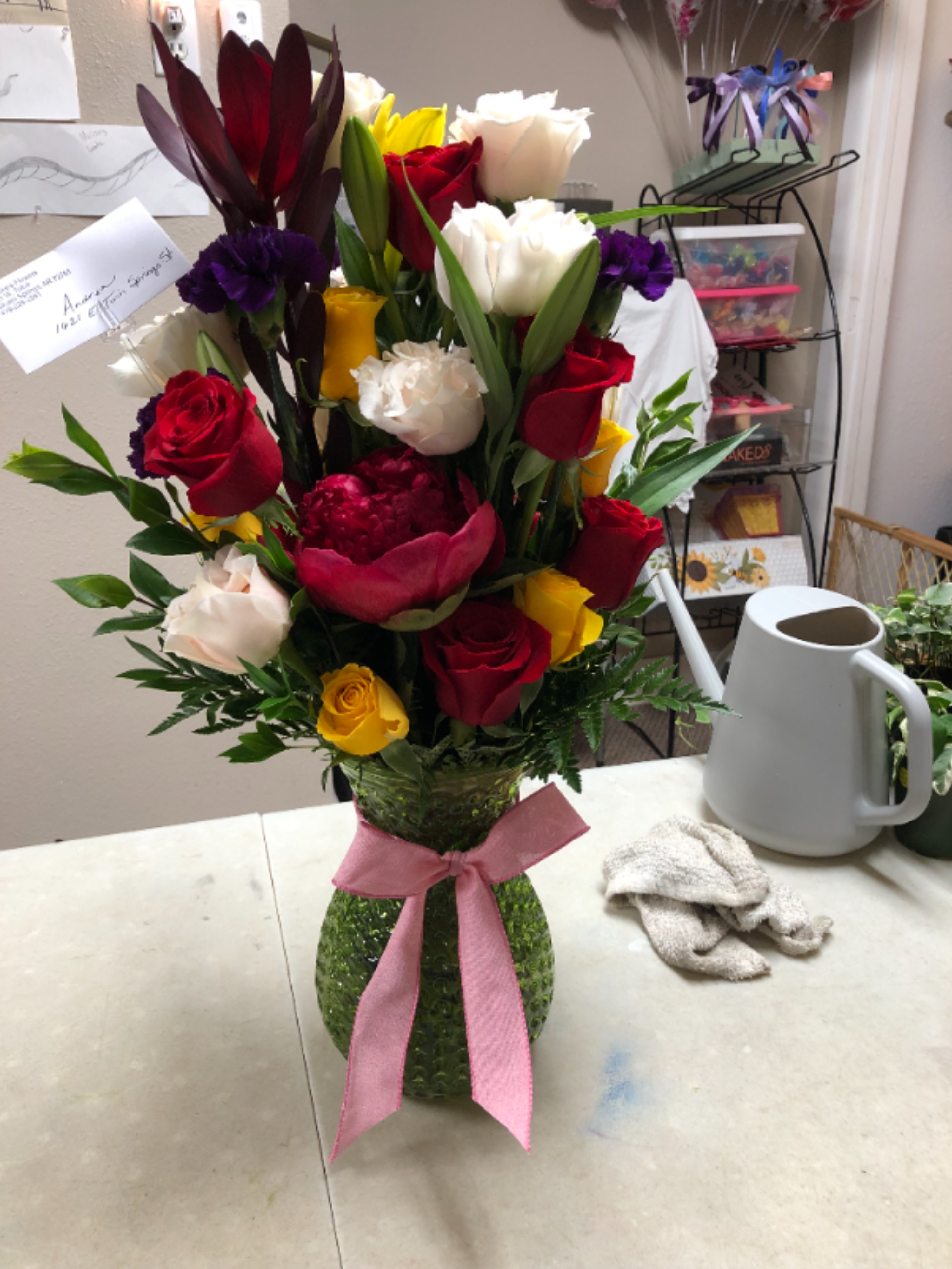 Safari Sunset by Brooke's Flowers - A tall, vibrant mixed bouquet that reads like a joyful celebration-perfect as a birthday bouquet, anniversary roses gift, or a romantic surprise. The arrangement's upright, densely packed silhouette showcases red, white, yellow, and purple blooms so the person you're thinking of will feel celebrated the moment they see it. Its bright, formal presence sends a clear message of affection and joy without saying a word. 