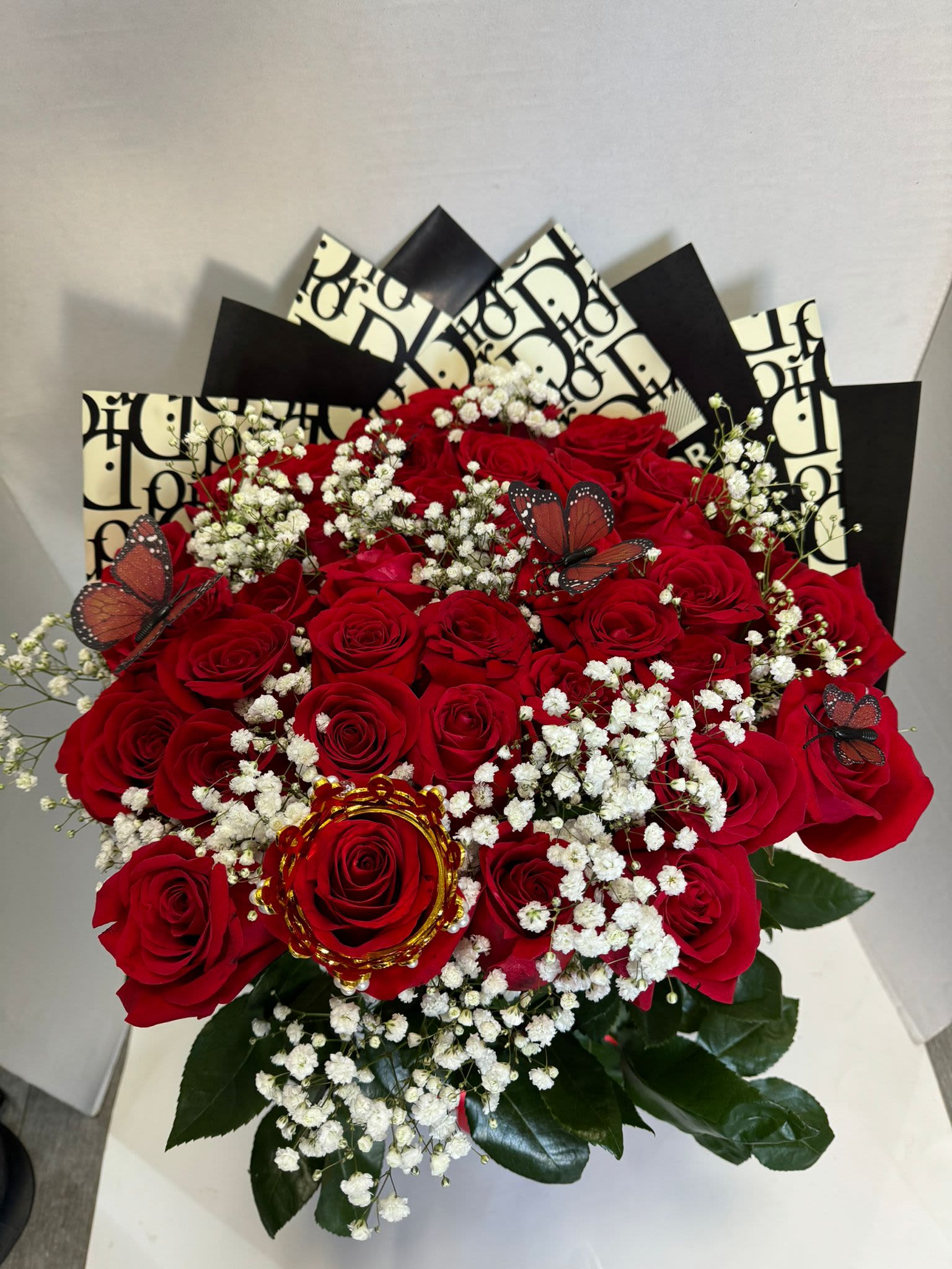 Radiant Arrangement - radiant arrangement with 36 roses in floral foam covered with Korean paper