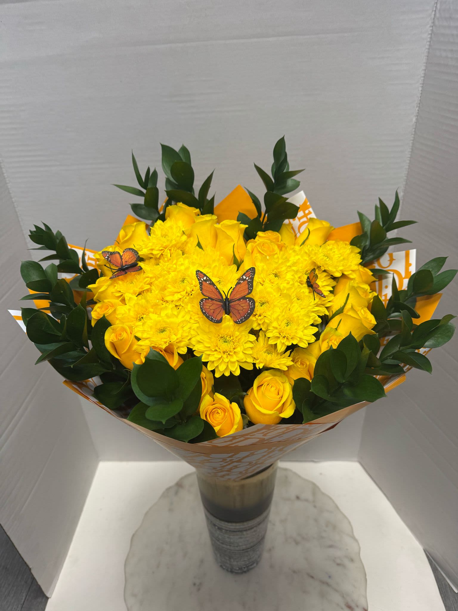 Sunshine Bouquet  - Embrace the beauty of nature in all its glory with our Yellow Roses with daysi.This  bouquet is the perfect gift for making your loved ones say “Wow!” This exclusive “ramos de flores” is an exemplary gift for Valentine’s Day, Mother’s Day, birthdays, anniversaries, graduation, and any important life milestone.Send flowers right to their home or place of work with our local flower delivery service today! We offer a variety of Ramo Buchón add on options. 